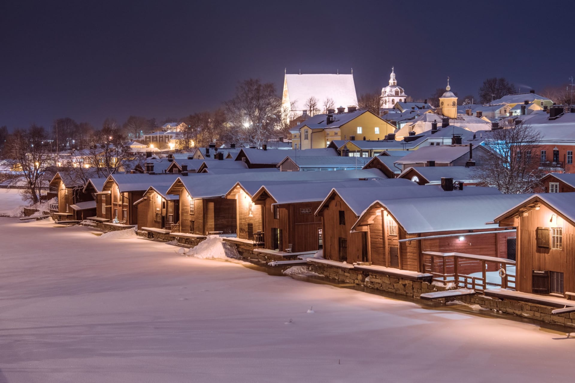 Red-ochre riverside warehouses