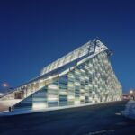 Vellamo in evening lights, some snow on the ground.