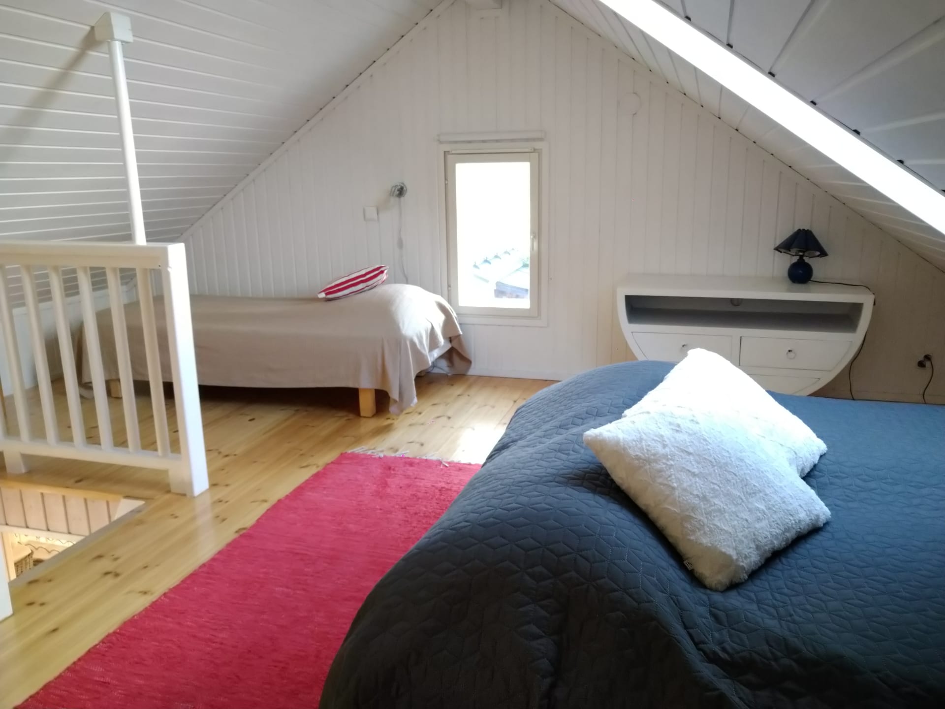 A mezzanine with beds. Th cottage accommodates 7 people in total