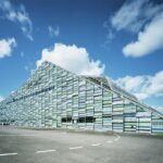 Cotton like clowds on otherwise clear sky on top of Maritime Centre Vellamo.