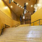 Long wooden staircase embraced with wooden walls and ceiling.