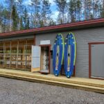 The building has rental offices for several entrepreneurs, and you can recognize Lapinsalmi Rental Base by the sign above the door ("Lapinsalmen välinevuokraamo").