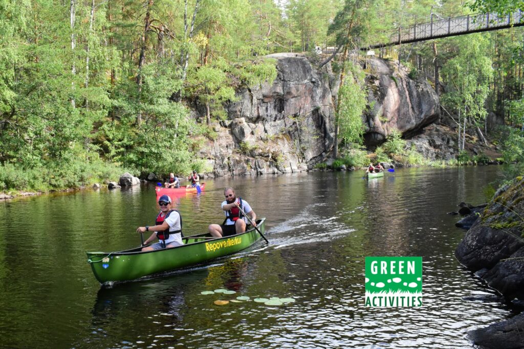 Canoeing under the suspension bridge in Repovesi National Park