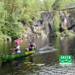 Canoeing under the suspension bridge in Repovesi National Park