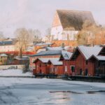 Red-ochre riverside warehouses in winter